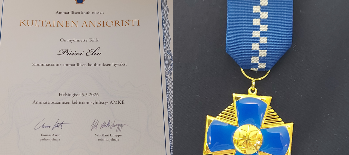 Kunniakirja ja kultainen mitali.